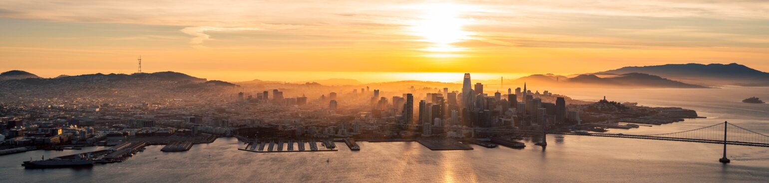 San Francisco Bay-side skyline at sunset.