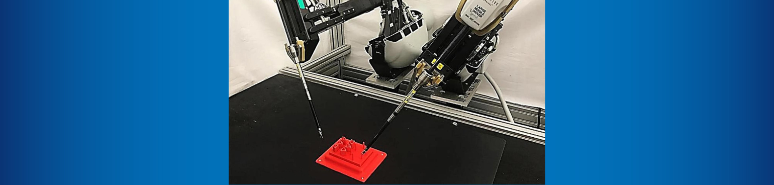 A da Vinci Research Kit robot completes a peg-transfer task.